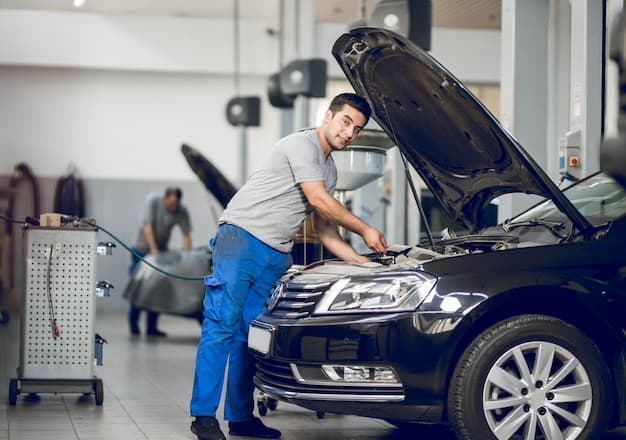 Mechanic repairing car engine